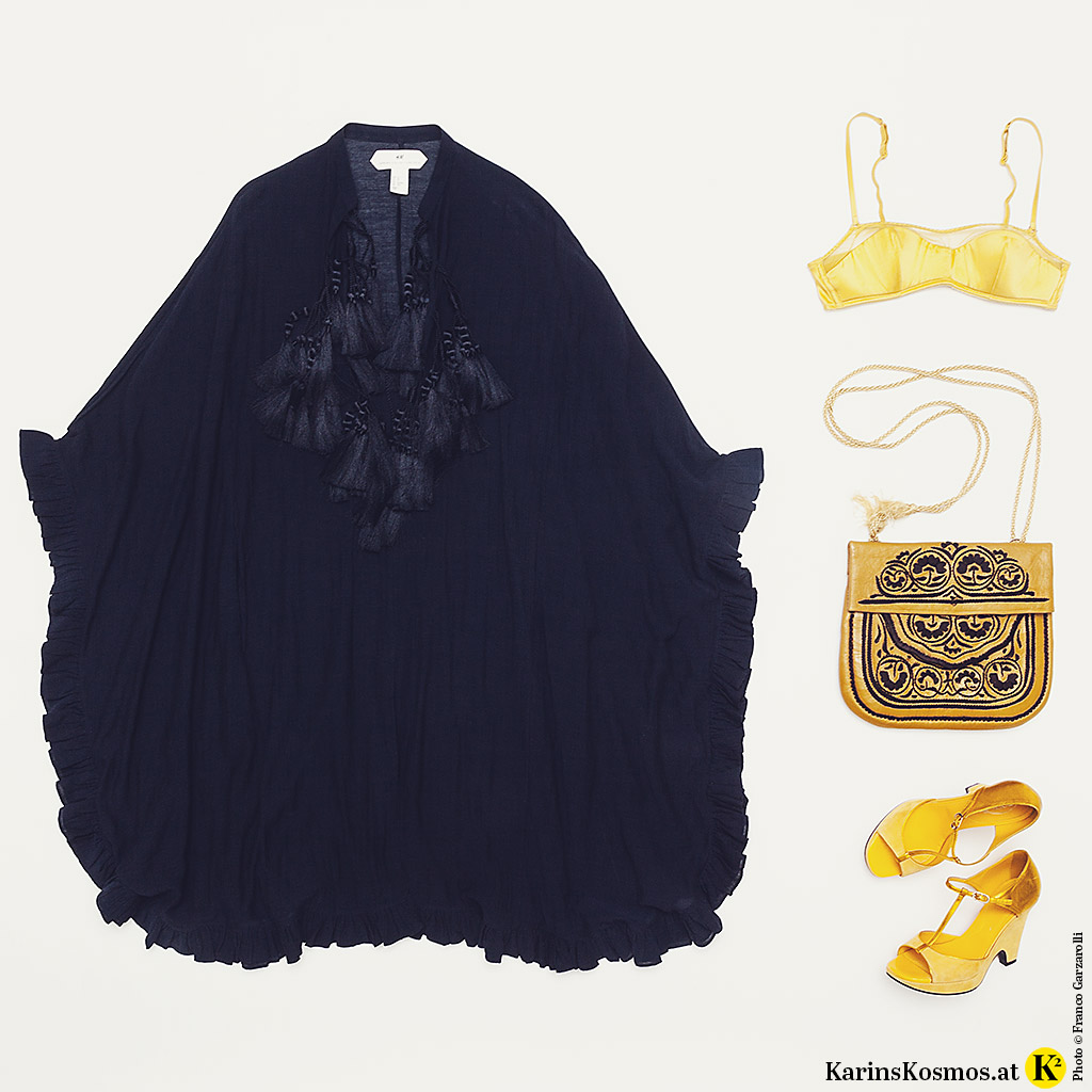 Produktfoto mit Kaftan für den Sommer, gelbem BH, Tasche und Sandalen.