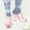 Pastellfarbene Burlington-Socken und Miu-Miu-Pantoletten.
